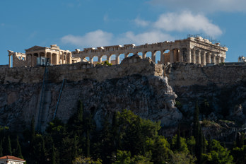 The Acropolis rock seen from the north, from the Agora. Rock with old fortress wall. The Erechtheion temple on the left and the Parthenon dominating in the background.