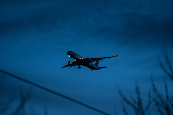 Airplane landing in Chicago O'Hare at blue hour