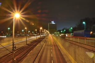 Long time exposure of a street at night. The high-rise building in the background has been demolished in the meantime.