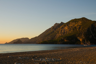 Beach with ships early in the morning