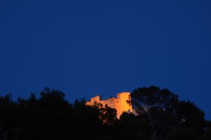 Illuminated ruin at night