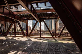 The upper deck is part of the Chicago Loop. (Chicago Elevated or L). The trains of  the  Brown and Purple lines.