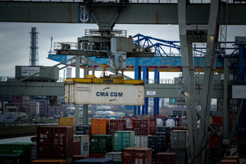 A gantry crane loads a container