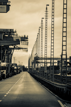 Long straight road with lamp posts