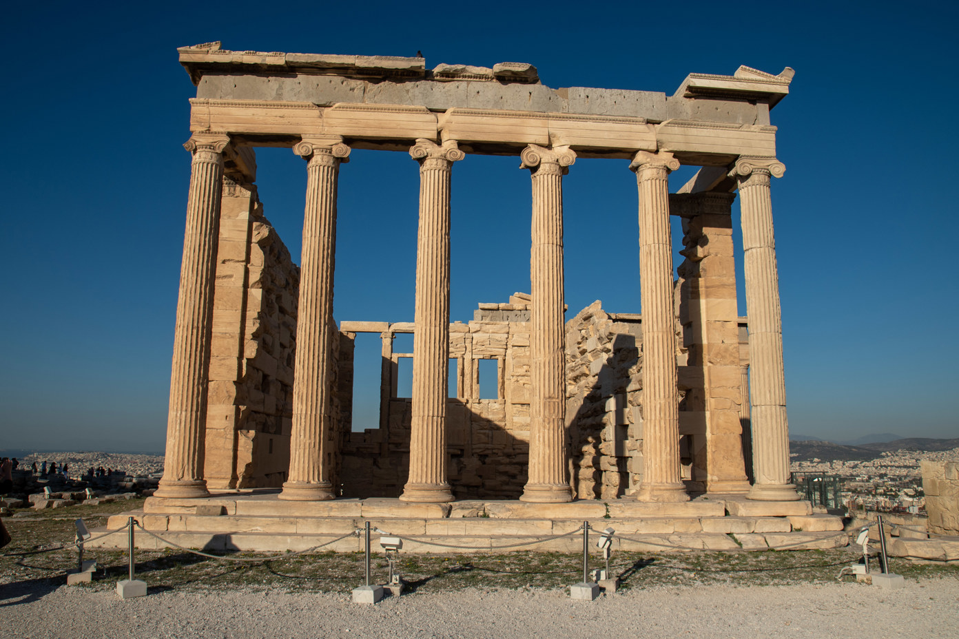 The columns of the Erechtheion illuminated by the morning sun on the Acropolis without any tourists.  