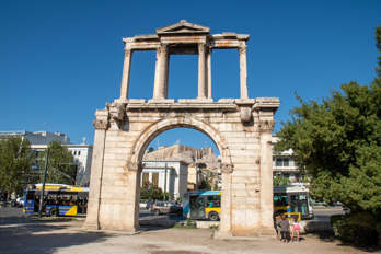 The ancient Hadrian's Gate from the southeast with a view of historic Athens and the Acropolis.