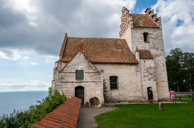 The old church of Højerup (Højerup Gamle Kirke) was built around 1250. The edge of the cliff (Stevns Klint) came closer and closer to the church and in 1928 part of the church collapsed into the sea. Højerup is a part of the municipality of Stevns whose administrative center is in Store Heddinge. 