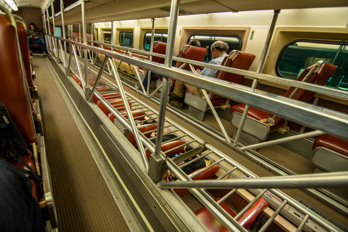The Metra train is a bilevel car or double-decker train car.
The photo was taken in the upper level.