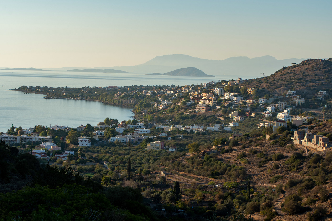 View from the valley of Eleonas, an uninhabited plateau on the island of Aegina in northwest direction over the hinterland of the bay of Marathonas. In the background the Saronic Gulf. The two larger Diaporia islands of Agios Thomas and Agios Ioannis can be seen on the left. On the right, the island of Ypsili (Υψηλή) or Psili (Ψηλή).