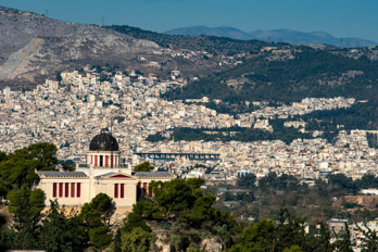 The National Observatory is a research center in Athens. Photo taken with a long focal length lens from the entrance to the Acropolis.