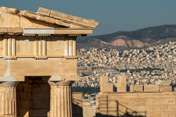 Close-up of the roof of the Propylaia on the Acroplis with a telephoto lens. In the background, the sea of houses in Athens.