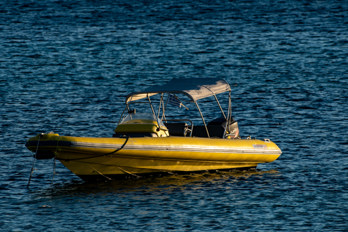 A Rigid Inflatable Boat (RIB) on Marathonas Beach on the island of Aegina in Greece