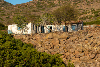 An abandoned ruin of a farmhouse near an old olive grove on the island of Aegina in the valley of Eleonas, an uninhabited plateau, about 2.5 km from the beach of Marathonas or 1.5 km from Aiginitissa.