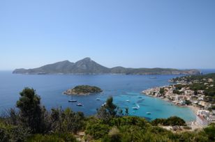 View from a hill to the bay of Sant Elm, the island Es Pantaleu and in the background the whole island Sa Dragonera .