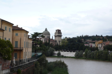 Picture was taken from the bridge Ponte Pietra. In the foreground the river Adige. On the left side the city center.