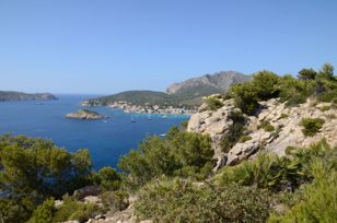 View from a hill to the bay of Sant Elm, the island Es Pantaleu and in the background the whole island Sa Dragonera .