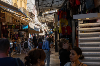 A lively shopping street in the historic old part of the city of Athens.