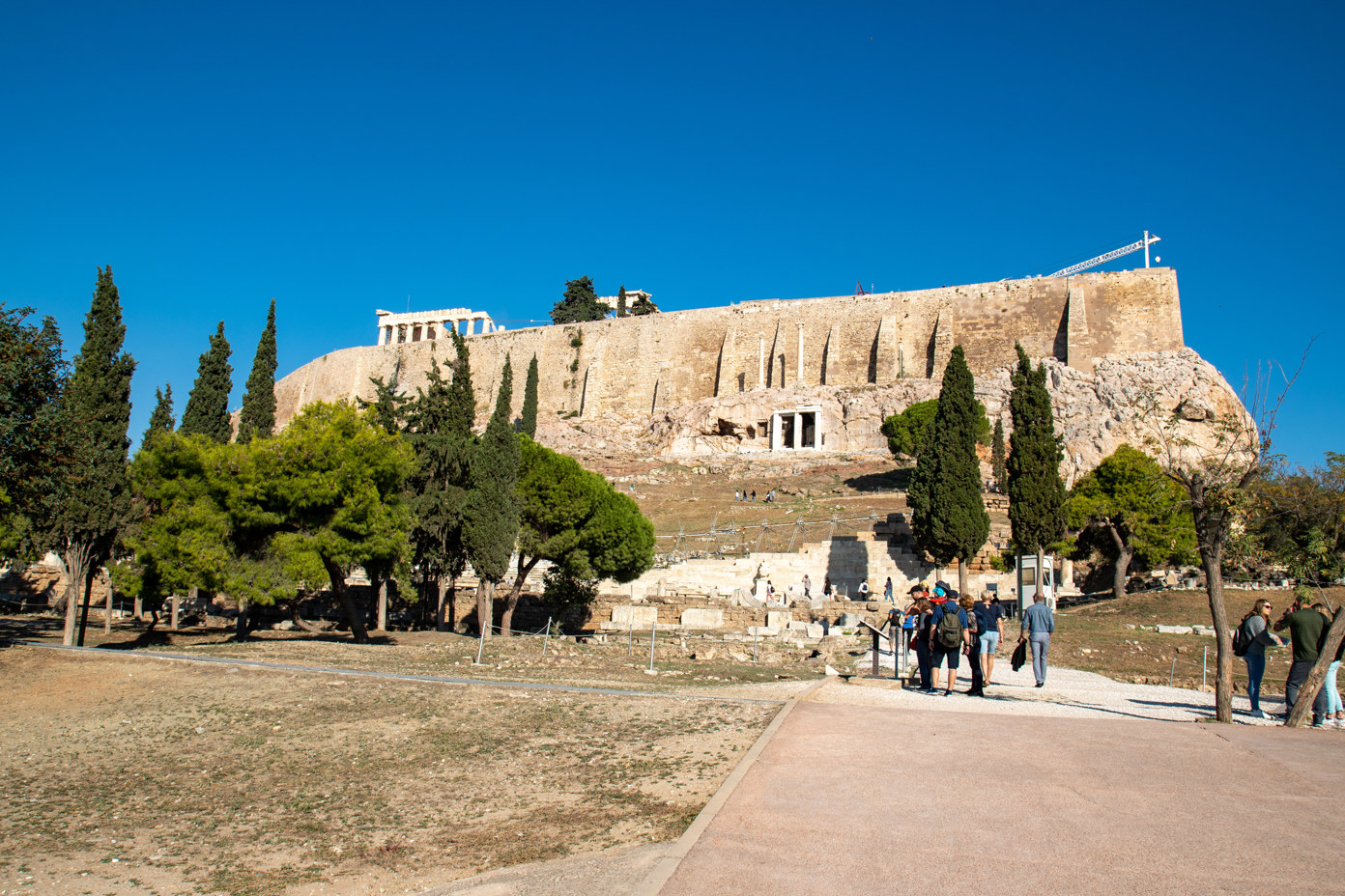 Southern view of the Acropolis Rock with Parthenon. In the center the Corinthian columns above the Choragic Monument. On the right a construction crane.