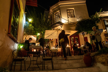 Restaurants in a staircase street in the evening in Athens