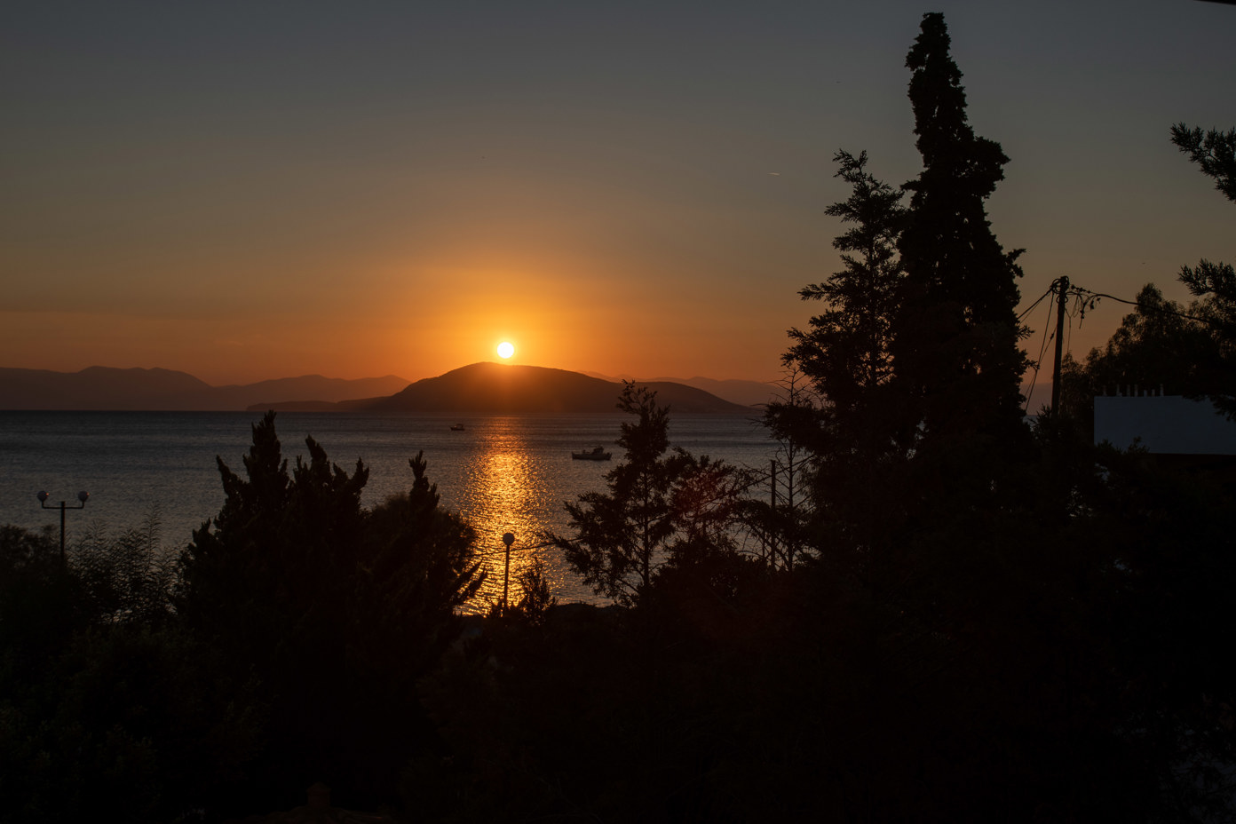 Sunset over the island of Agistri from Marathonas beach