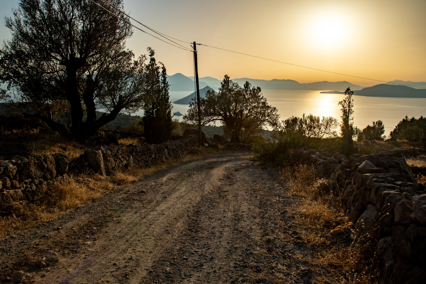 Sunset over a dirt road on the island of Aegina