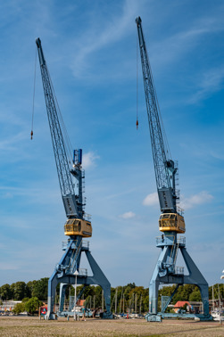 The two blue gantry cranes were built in the 1960s by the former GDR combine TAKRAF (open-cast mining equipment, cranes and conveyor systems) and were used to load and unload cargo at the city port of Rostock. 