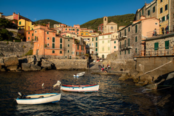 Small fishing harbor with boats in the evening sun