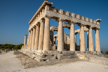 View of the Temple of Aphaia from the south-east. The Doric columns rest on a three-tiered crepis, the above-ground substructure of a Greek temple. On the right, the eastern stone ramp leading to the crepis.