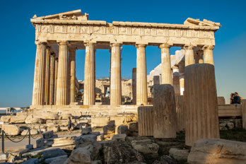 The Parthenon from the east in the morning sun. In the foreground the remains of the Temple of Rome and Augustus 