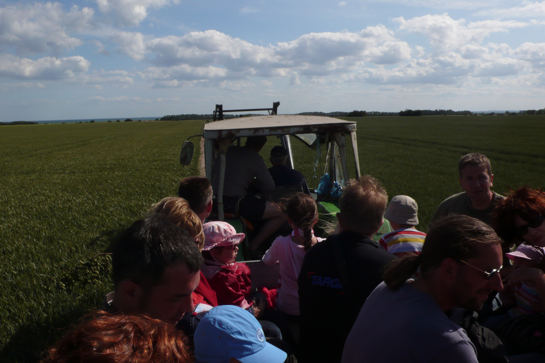 Tractor ride across the fields to the beach