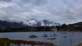 Bay in the lake Garda after rain with boats