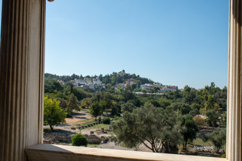 View over the Athenian Agora through the columns of the upper floor of the Stoa of Attalos. In the background the 
National Observatory of Athens.