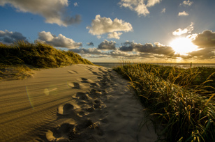 Sun and clouds in Denmark on the North Sea.
